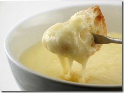 Cheese fondue half dipped